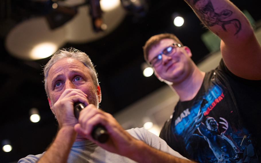 Comedian Jon Stewart relays an audience question during a USO show at Osan Air Base, South Korea, Monday, April 23, 2018.