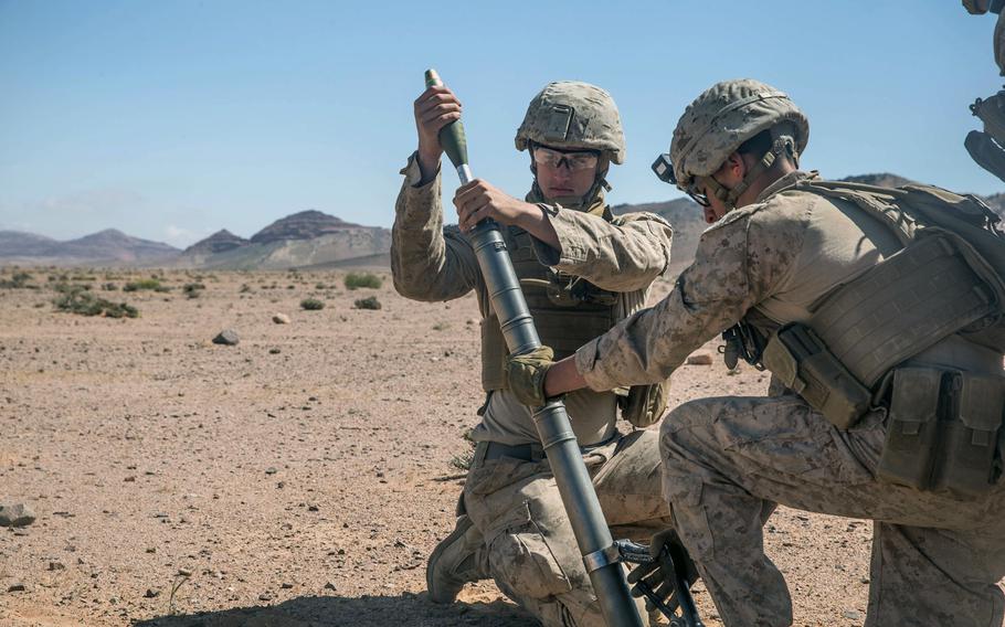 U.S. Marines assigned to Fox Company, Battalion Landing Team, 2nd Battalion, 6th Marine Regiment, 26th Marine Expeditionary Unit, prepare to fire an M224A1 60MM mortar system during Eager Lion training operations in Jordan, Sunday, April 22, 2018.