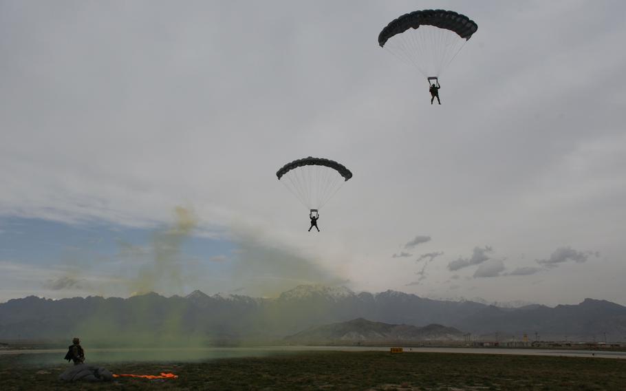 Two pararescuemen with the Air Force's 83rd Expeditionary Rescue Squadron practice a high-altitude, high opening jump at Bagram Air Field, Afghanistan, on March 23, 2018.