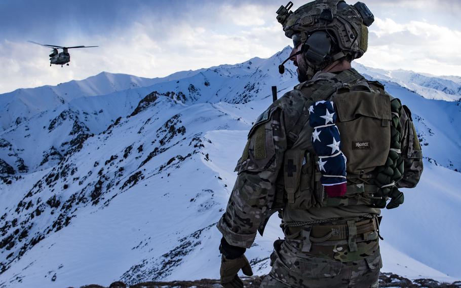 A U.S. Air Force pararescueman, assigned to the 83rd Expeditionary Rescue Squadron, communicates with an Army Task Force Brawler CH-47F Chinook during a training exercise at an undisclosed location in the the mountains of Afghanistan, March 14, 2018.