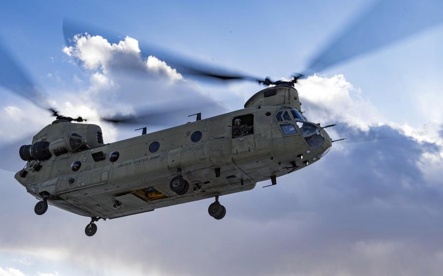 A U.S. Army Task Force Brawler CH-47F Chinook prepares to land during a training exercise with an Air Force Guardian Angel team assigned to the 83rd Expeditionary Rescue Squadron at Bagram Airfield, Afghanistan, March 14, 2018.