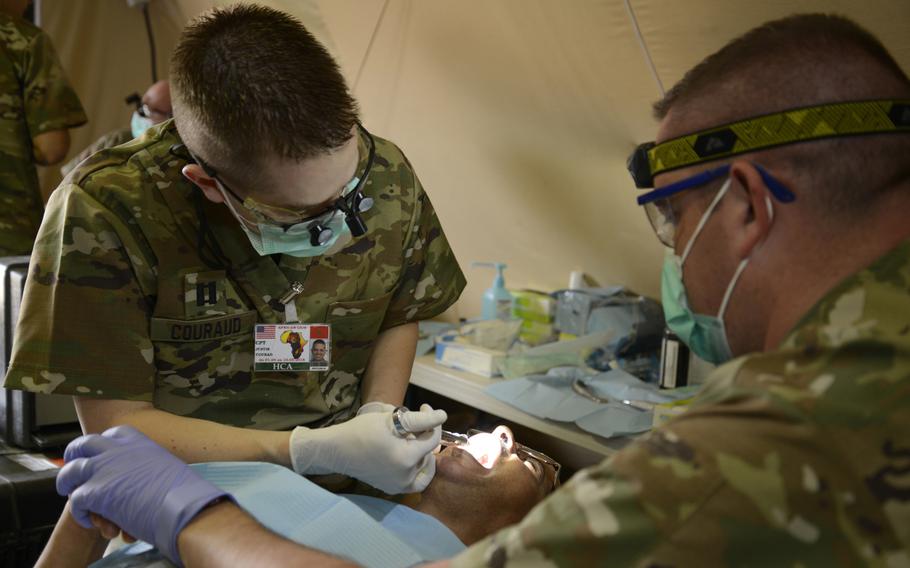 Capt. Justin Couraud, a dentist with the Utah National Guard Medical Detachment, injects a patient during the humanitarian civic assistance component of exercise African Lion 2018 in Bounaamane, Morocco, April 20, 2018.
