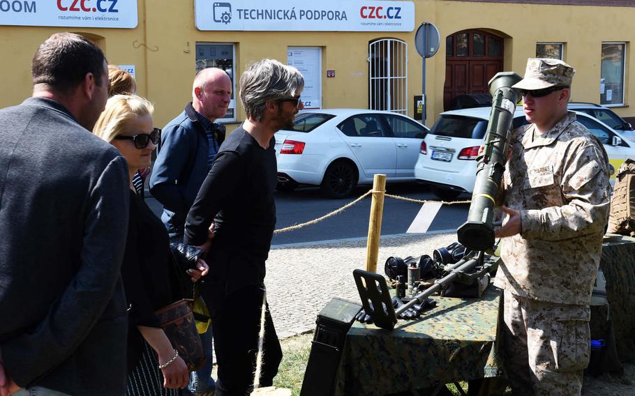 A Czech re-enactor shows a U.S. AT-4 rocket launcher during the a festival in Pilsen, Czech Republic, marking the liberation of the city from the Nazis, Friday, May 4, 2018.