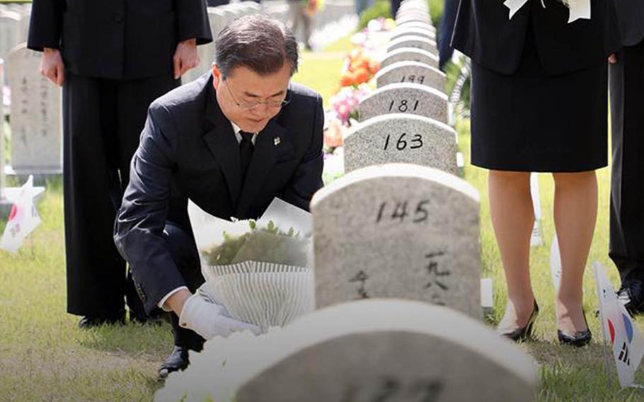 President Moon Jae-in pays tribute to a South Korean soldier killed during the 1950-53 war during a Memorial Day ceremony at the Daejeon National Cemetery, Wednesday, June 6, 2018.