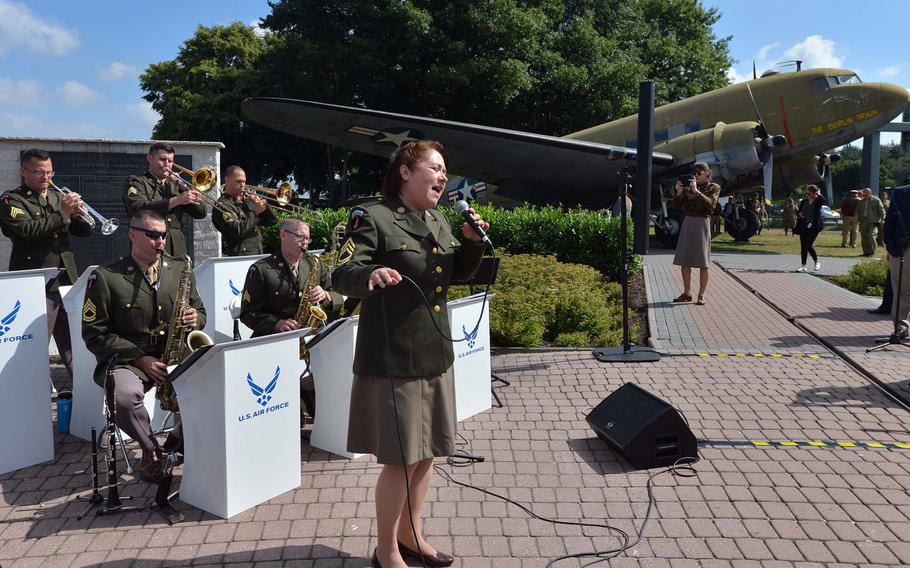 The Ambassadors, a jazz group from the USAFE Band, entertains the visitors before the start of the ceremony marking the 70th anniversary of the Berlin Airlift at the Berlin Airlift Memorial at Frankfurt airport, Tuesday, June 26, 2018.