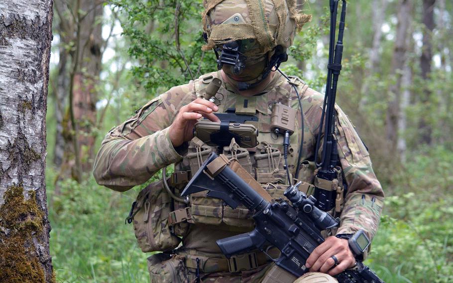 First Lt. Michael Austin, platoon leader for Attack Co., 1-503rd Infantry Regiment, 173rd Airborne Brigade, reports information to his company commander through the Integrated Tactical Network during a live-fire exercise in Grafenwoehr, Germany, May 2, 2018.