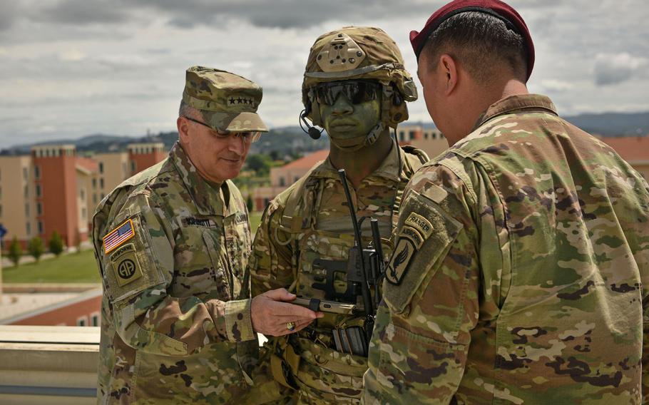 Gen. Curtis Scaparrotti, head of United States European Command, looks at the Integrated Tactical Network System worn by 173rd Airborne Brigade's Spc. Jamal Hersey, in Vicenza, Italy, June 22, 2018.