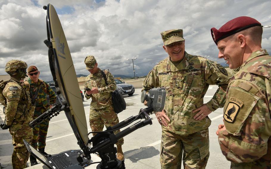 Staff Sgt. Don Leroy, right, assigned to the 173rd Airborne Brigade, shows Gen. Curtis Scaparrotti, commander of U.S. European Command, the Integrated Tactical Network system at Vicenza, Italy, June 22, 2018.