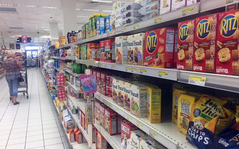 A shopper passes Ritz crackers displayed on an aisle of the main commissary, July 26, 2018, at the U.S. Navy base in Naples, Italy. Most Ritz Bits and Ritz Sandwiches were recalled because of salmonella concerns. They are part of a list of recently recalled commissary items.