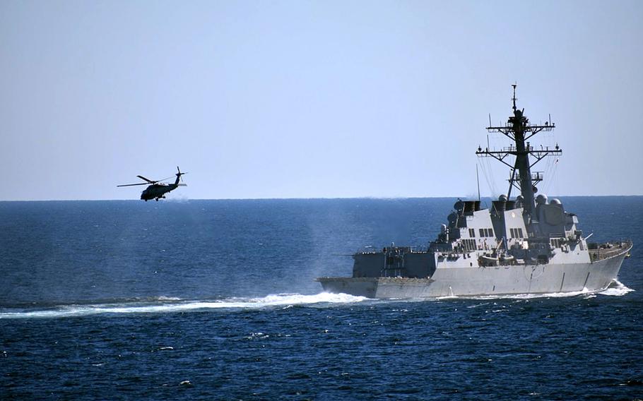 The USS Preble launches its MH-60 helicopter while transiting the Strait of Hormuz, Jan. 11, 2018.