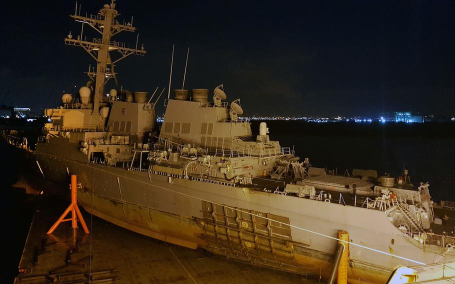 The guided missile destroyer USS John S. McCain is loaded onto heavy lift transport MV Treasure, Oct. 6, 2017.