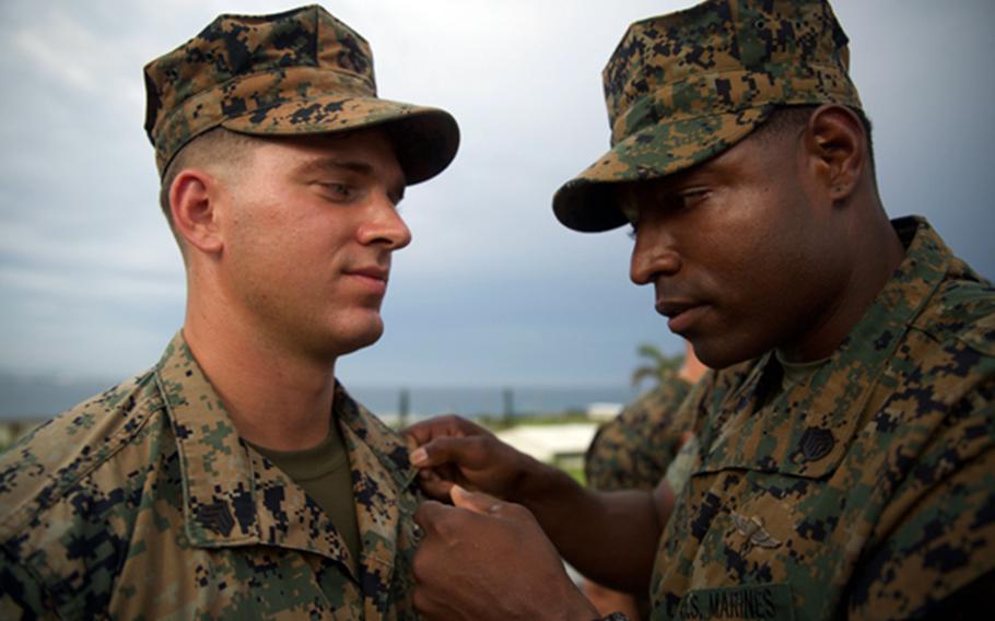 Cpl. Isaiah Bernstein of the 3rd Reconnaissance Battalion, 3rd Marine Division is pinned following his meritorious promotion to sergeant at Camp Courtney, Okinawa, Aug. 2, 2018.