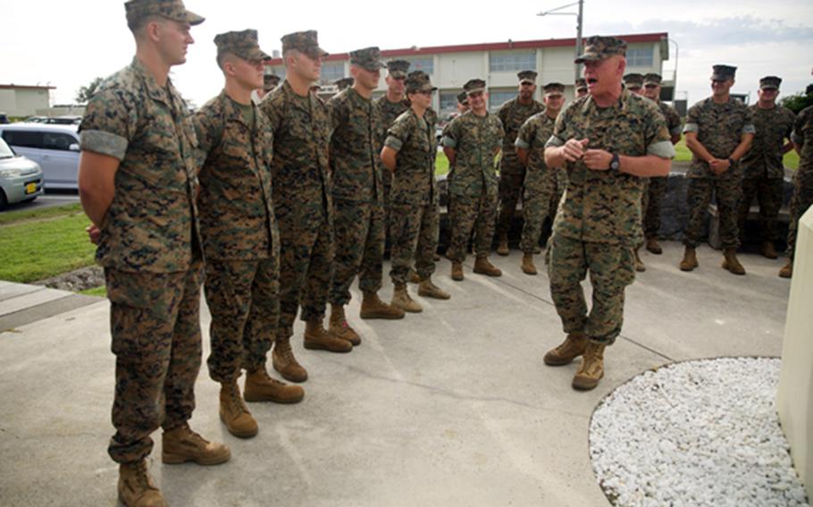 III Marine Expeditionary Force Commander Lt. Gen. Lawrence Nicholson meritoriously promotes five Marines and a Navy corpsman at Camp Courtney, Okinawa, Aug. 2, 2018. Sgt. Isaiah Bernstein is at far left.