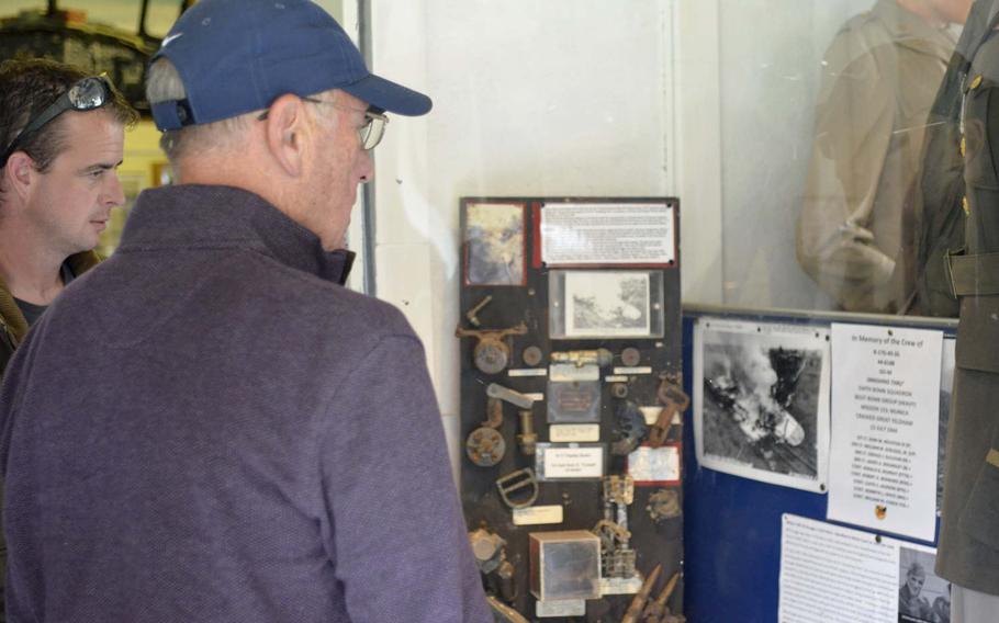 American Ken Spatz and British farmer Andy Cox read about the crash of a B-17 called Smashing Thru during World War II at the Ridgewell Airfield Commemorative Museum in Ridgewell, England, Friday, Aug. 31, 2018. Spatz's father and seven other crew members perished in the crash on July 13,1944.
