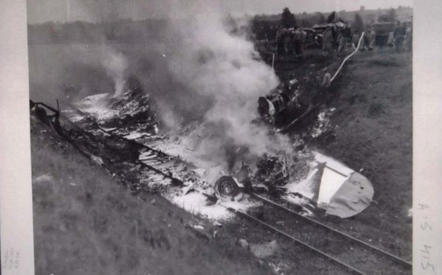 Photo of the crash of a B-17 Flying fortress named Smashing Thru in Ridgefield, England, July 13,1944. Eight crew members were killed as the plane skidded into an unseen railroad cut during an emergency landing.
