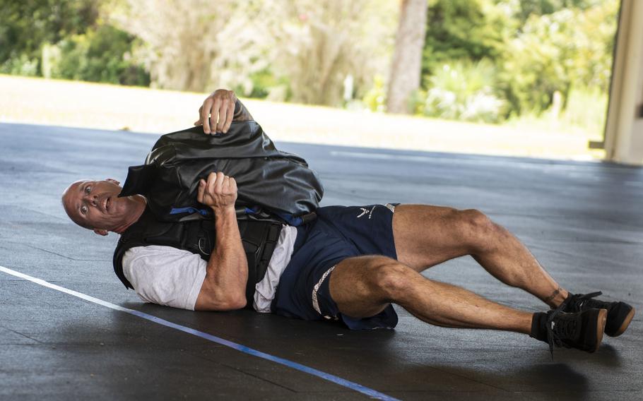 Lt. Col. Anthony Raus, an Explosive Ordnance Disposal Airman based at Fort Bragg, N.C., performs the ''Gruester'? exercise during the beta test of the EOD Tier 2 fitness test prototype, Sept. 10, 2018, at Eglin Air Force Base, Fla.