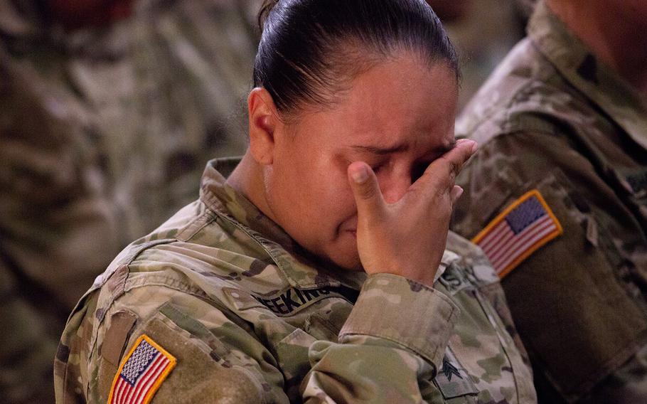 A soldier mourns Pfc. Adrienne Barillas at the Warrior Chapel on Camp Humphreys, South Korea, Monday, Oct. 1, 2018.