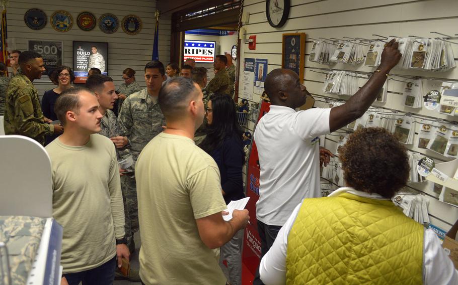 Airmen at Aviano Air Base's military clothing store shop for items required for their new Operational Camouflage Pattern uniforms, Monday, Oct. 1, 2018. Aviano is one of the first Air Force bases to begin selling the new OCP uniform.