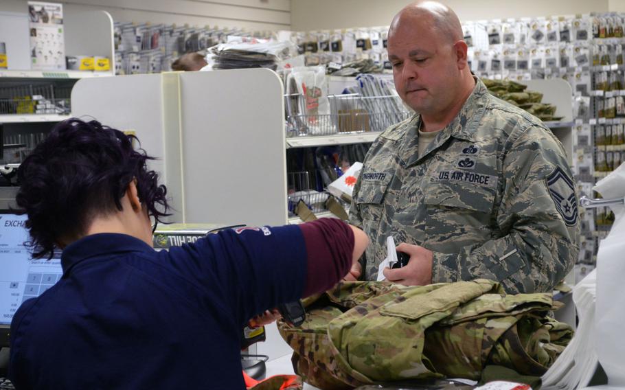 Senior Master Sgt.Thomas E. Longworth, a Readiness and Emergency Management specialist with the 31st Civil Engineering Squadron, 31st Fighter Wing, Aviano Air Base, Italy, purchases the new Operational Camouflage Pattern uniform at the base's military clothing shop, Monday, Oct. 1, 2018.