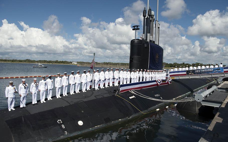 The crew of the USS Indiana stands at attention during the submarine's commissioning ceremony in Port Canaveral, Fla., Sept. 29, 2018.