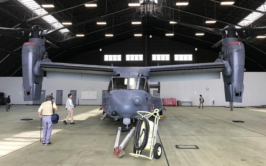 Japanese journalists check out a CV-22 Osprey at Yokota Air Base, Japan, Wednesday, Oct. 3, 2018.