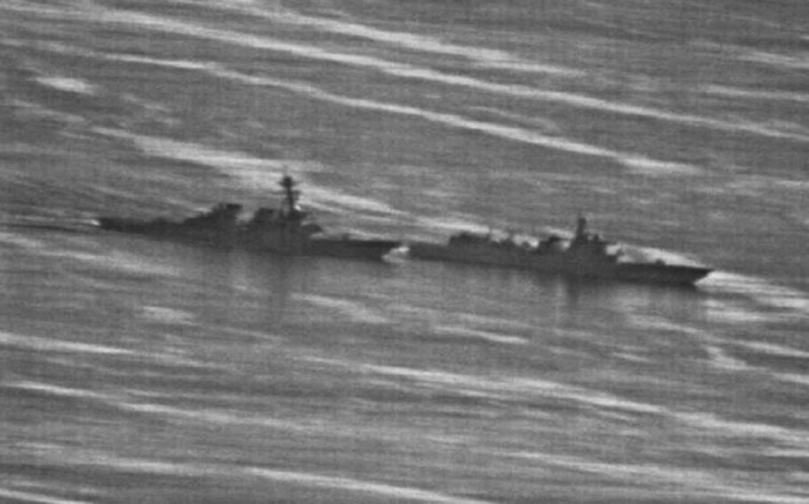 This Navy image obtained by naval website gCaptain.com shows a confrontation between the USS Decatur, left, and a Chinese destroyer in the South China Sea, Sunday, Sept. 30, 2018.