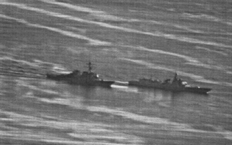 This Navy image obtained by naval website gCaptain.com shows a confrontation between the USS Decatur, left, and a Chinese destroyer in the South China Sea, Sunday, Sept. 30, 2018.