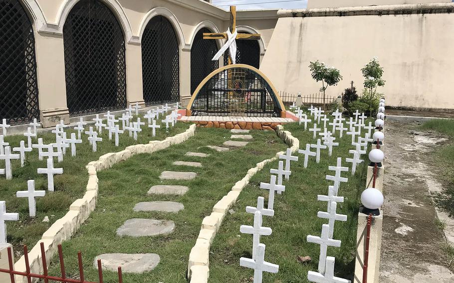 The rebuilt church at Balangiga is next to an outdoor ossuary where bones were recently unearthed that locals think might belong to American soldiers.