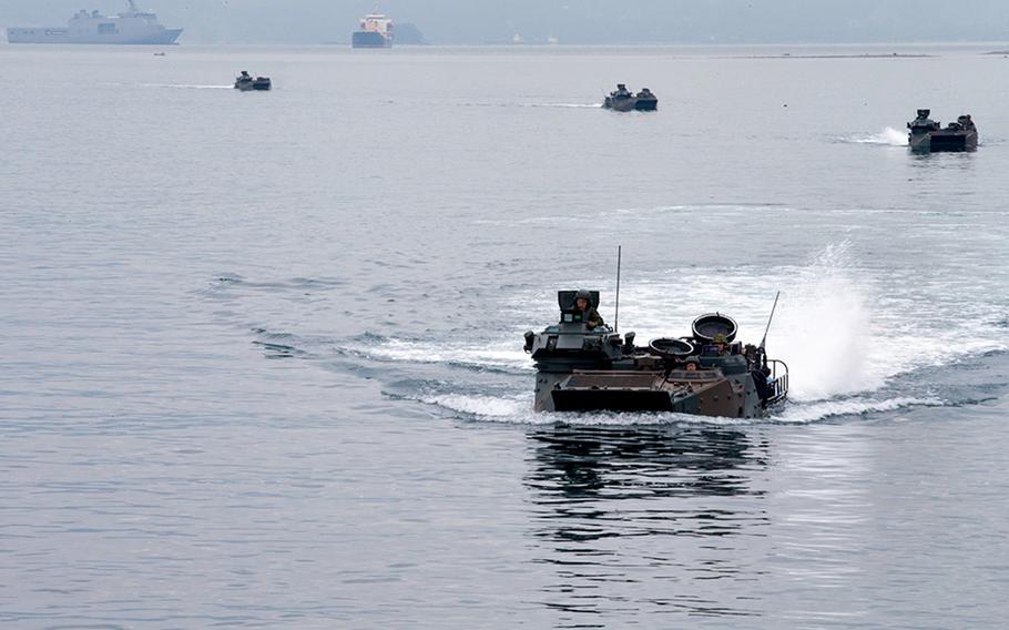 Japanese troops in amphibious-assault vehicles prepare to embark aboard the USS Ashland in assault amphibious vehicles during Kamandag drills in Subic Bay, Philippines, Oct. 3, 2018.