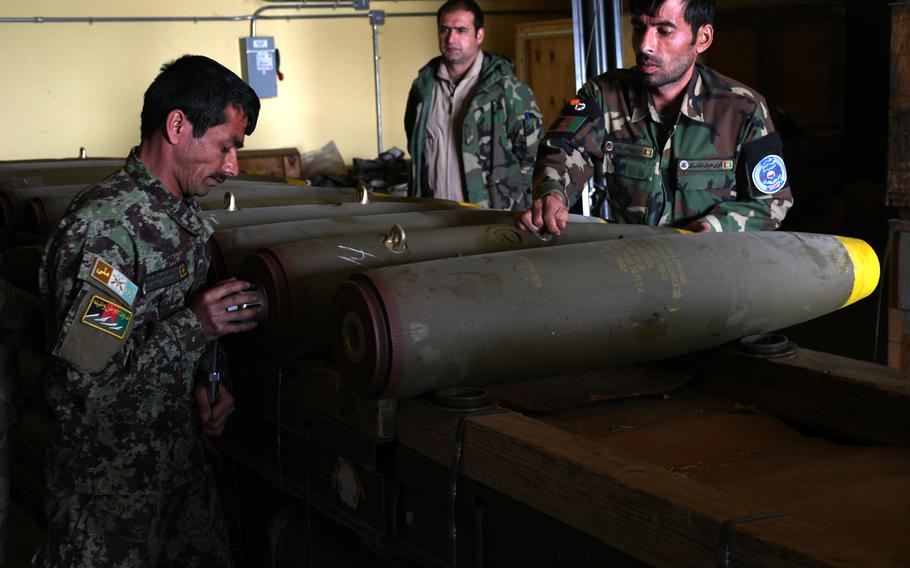Afghan troops on March 6, 2018, assemble munitions to be used in airstrikes by the Afghan air force. The United Nations has expressed concern over a growing number of civilian casualties caused by airstrikes by both Afghan and international forces this year.
