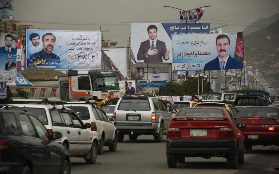 Election posters line a Kabul street on Monday, Oct. 8, 2018. Afghanistan's parliamentary elections are set for Oct. 20, 2018.