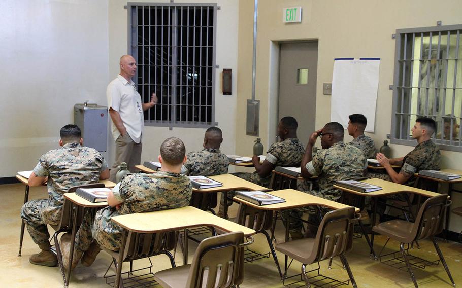 Correctional treatment specialist Michael Long teaches a class in August at the brig in Camp Hansen, Okinawa.