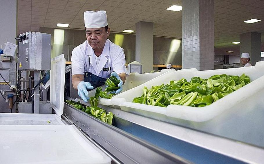 A Japanese worker prepares vegetables for eight Marine Corps dining halls on Okinawa, Friday, Oct. 12, 2018.