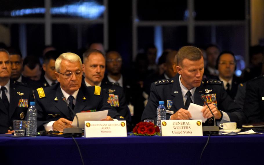 Gen. Tod Wolters, U.S. Air Forces in Europe - Air Forces Africa commander, right, and Lt. Gen. El Abed Alaoui Bouhamid, inspector of the Royal Moroccan Air Force, look through their notes during the opening ceremony of the eighth annual African Air Chiefs Symposium on Monday, Oct. 22, 2018, in Marrakesh, Morocco.