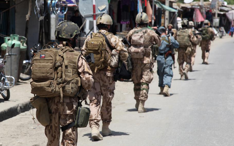Czech soldiers patrol through Dihi Babi village, Parwan province, Afghanistan, April 29, 2014. The Czech Defense Ministry has confirmed that the NATO servicemember killed in Herat yesterday was Czech.