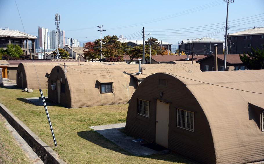 A row of Quonset huts at Camp Red Cloud, South Korea, with a view of the surrounding city of Uijeongbu is seen Sunday, Oct. 21, 2018.
