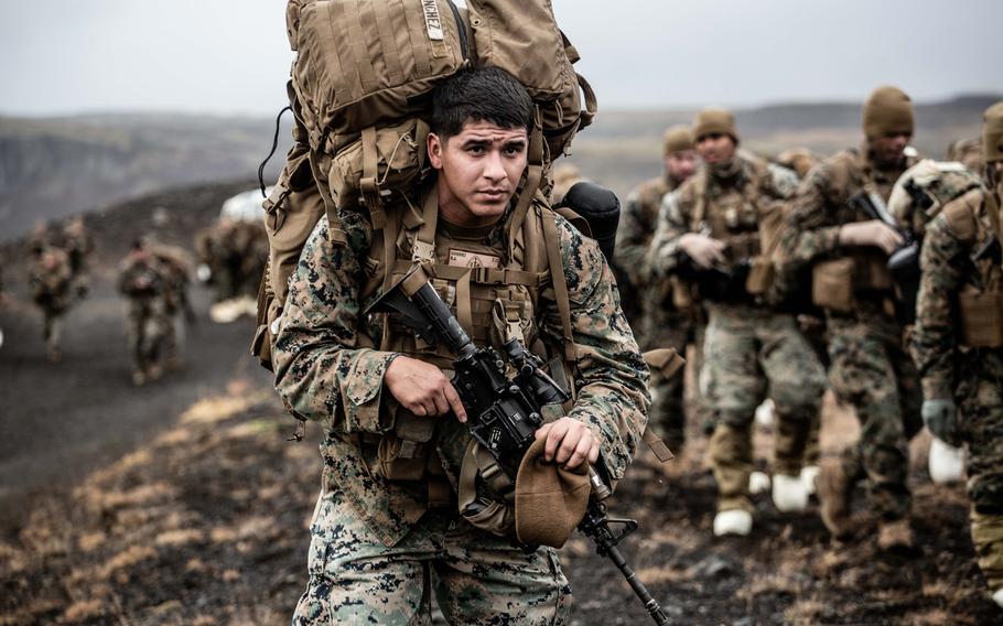 A U.S. Marine carries cold weather equipment as he begins to march across the Icelandic terrain Oct. 19, 2018. Marines with the 24th Marine Expeditionary Unit are in Iceland preparing for NATO's Trident Juncture 2018. 

