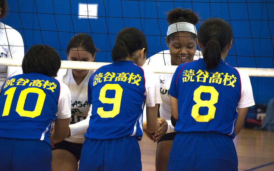 High school volleyball players from the U.S. and Japan greet one another after a match at Kadena Air Base, Okinawa, Saturday, Oct. 20, 2018.