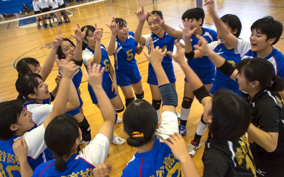 Volleyball players from a high school on Okinawa cheer before a match at Kadena Air Base, Okinawa, Saturday, Oct. 20, 2018.