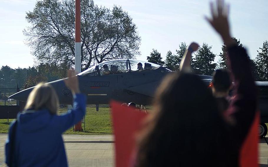 Family members greet F-15E Strike Eagle pilots from the 494th Fighter Squadron as they return from a six-month combat deployment fighting the Islamic State to RAF Lakenheath, England, Sunday, Oct. 7, 2018. The last contingent of airmen returned last week, service officials said.