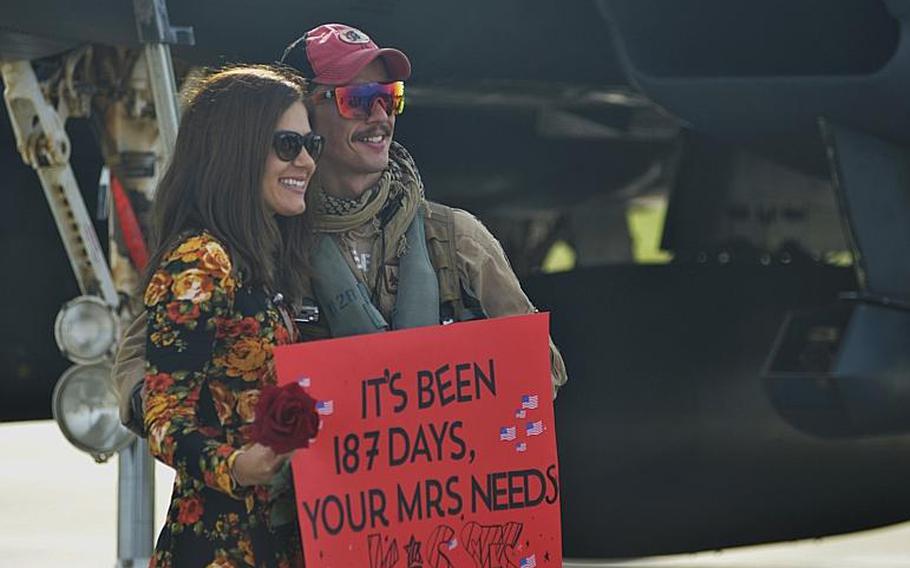 An F-15E Strike Eagle pilot reunites with his wife after returning home from a combat deployment to RAF Lakenheath, England, Sunday, Oct. 7, 2018. The 494th Fighter Squadron flew 2,000 sorties in about 11,000 flight hours and dropped more than 500 precision-guided munitions during the six-month deployment in South East Asia.