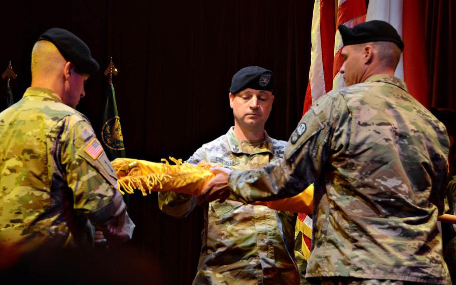 Col. Patrick Costello, center, unfurls the newly reformed 38th Air Defense Artillery Brigade's colors during a reactivation ceremony at Camp Zama, Japan, Wednesday, Oct. 31, 2018.
