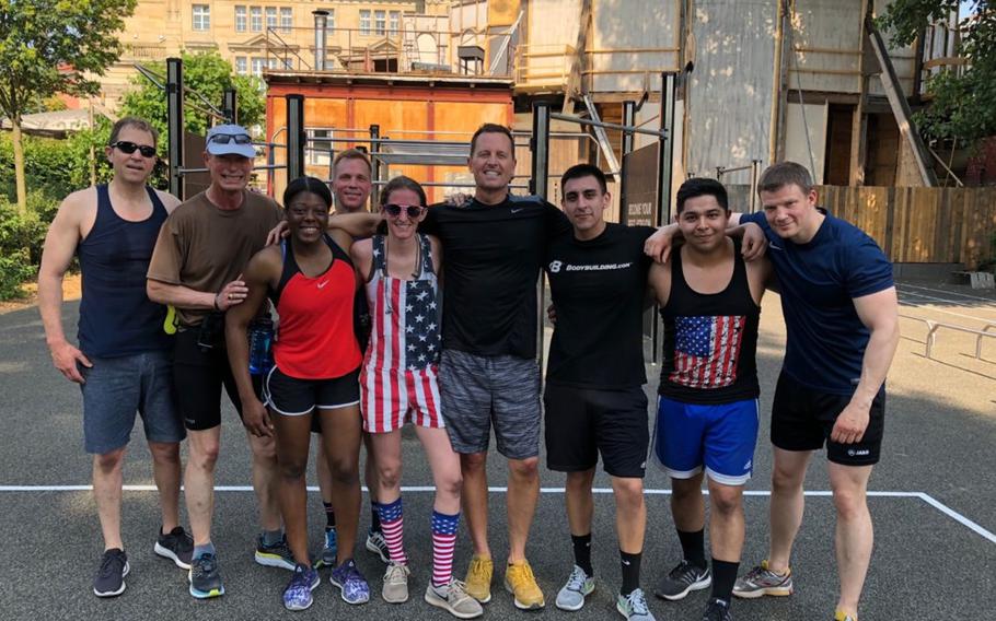 U.S. Ambassador to Germany Richard Grenell poses with embassy Marines during a Memorial Day fitness challenge in Berlin, May 28, 2018. 

