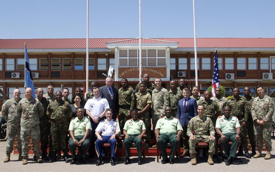 Lead planners from U.S. Army Africa and the Botswana Ground Forces take a group photo in front of the Botswana GFC headquarters Oct. 26, 2018, at the conclusion of the first planning event for the 2019 African Land Forces Summit 19.