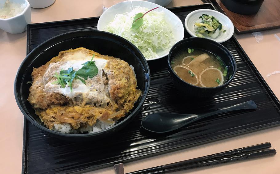 Maisen's version of Katsu-do, a popular Japanese food item, comes with tender tonkatsu and fluffy egg over a bowl of rice.