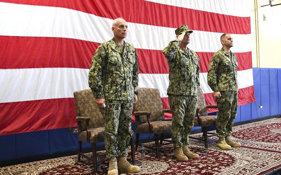 Vice Chief of Naval Operations Adm. Bill Moran, center, salutes as taps is played during a memorial service honoring Vice Adm. Scott Stearney on Naval Support Activity Bahrain, Wednesday, Dec. 5, 2018.  Stearney, who led U.S. Naval Forces Central Command and the 5th Fleet, was found dead at his Bahrain home Dec. 1.