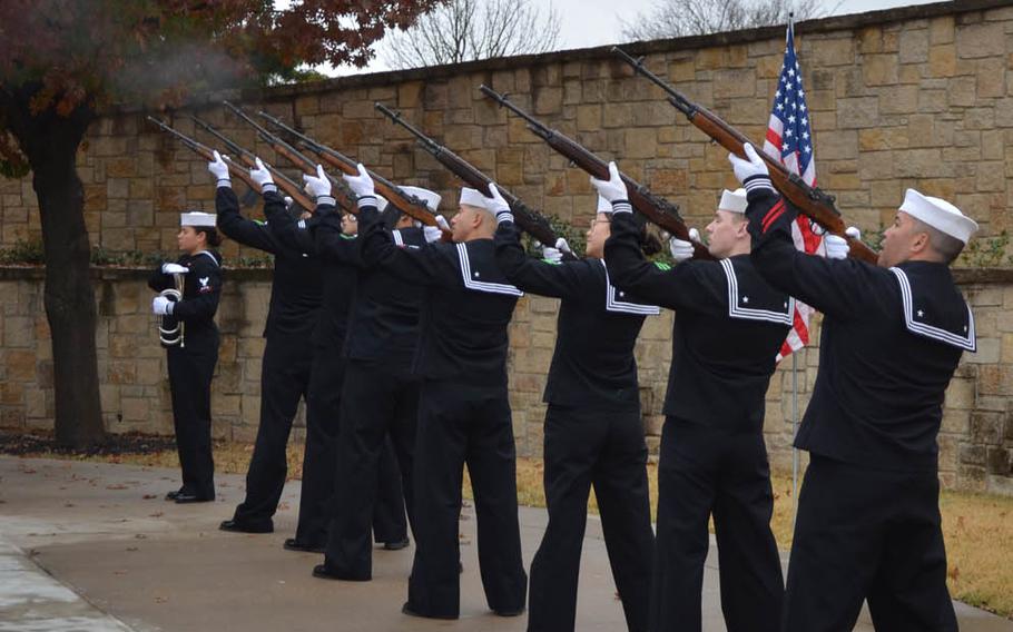Sailors conduct a 21-gun salute to honor the service of Fireman 1st Class Albert Kane, who died on the USS Oklahoma during the attack on Pearl Harbor. He was buried Friday at the Dallas Fort Worth National Cemetery.