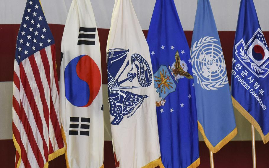 Flags, including those from the United States, South Korea and the United Nations, are displayed at Osan Air Base, South Korea, Aug. 27, 2018.
