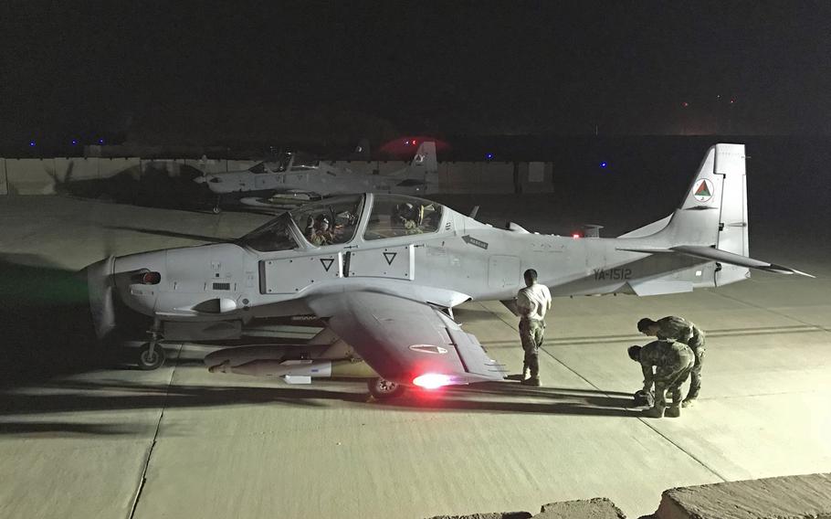 An Afghan air force A-29 is inspected after a night combat mission May 17, 2018, in Kabul, Afghanistan. The Afghan air force has conducted its first ever nighttime airstrikes after months of training by U.S. and international forces.