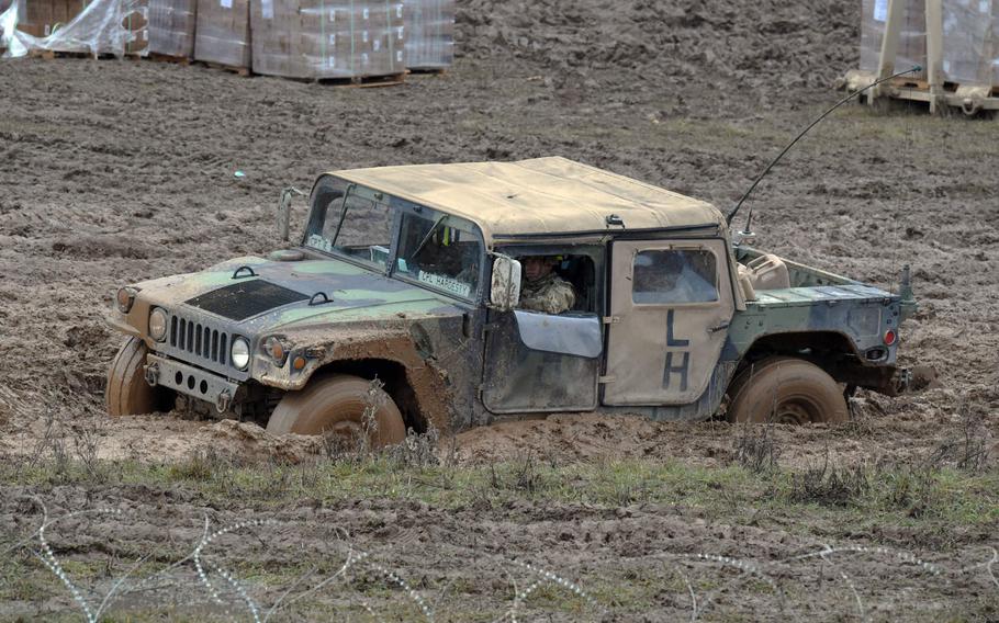A Humvee is stuck in the mud at exercise Combined Resolve XI, at Hohenfels, Germany, Monday, Dec. 10, 2018.
